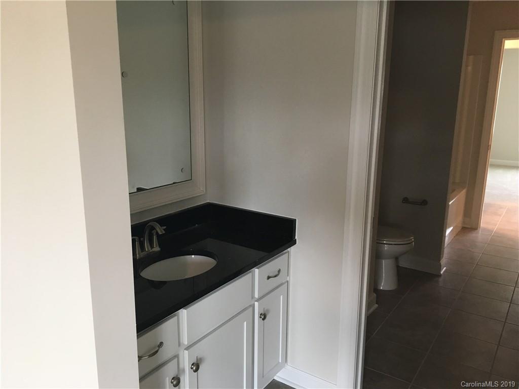17526 Shearer Road, Unit 96 Davidson, NC 28036 - Photo 18 of 25 a bathroom with a sink and a toilet