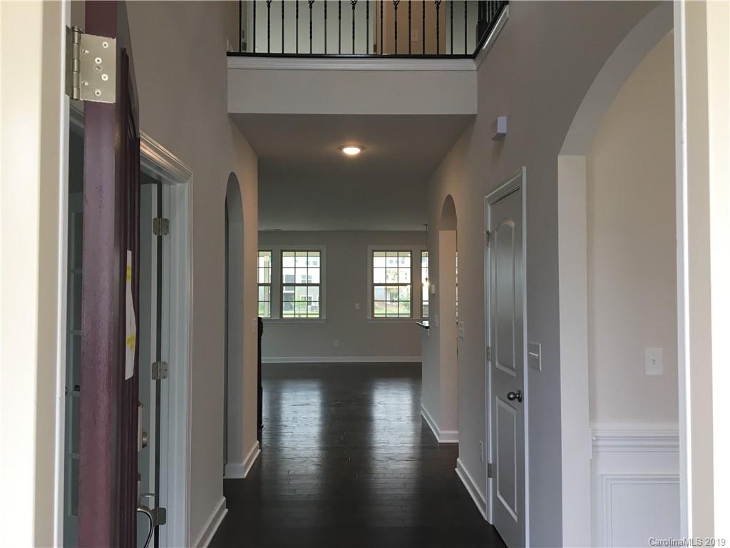 17526 Shearer Road, Unit 96 Davidson, NC 28036 - Photo 5 of 25 a view of gallery with wooden floor