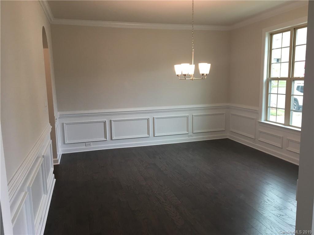 17526 Shearer Road, Unit 96 Davidson, NC 28036 - Photo 6 of 25 wooden floor in an empty room with a window