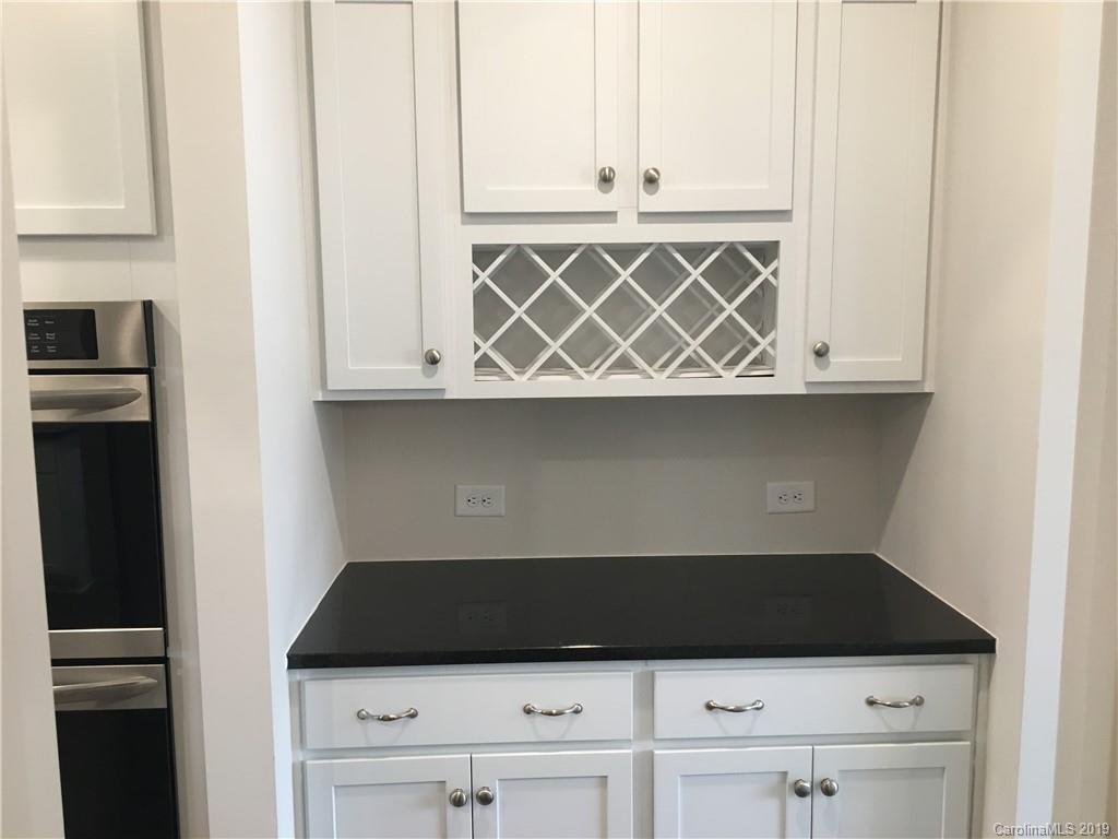 17526 Shearer Road, Unit 96 Davidson, NC 28036 - Photo 7 of 25 a close view of a stove top oven sitting inside of a kitchen