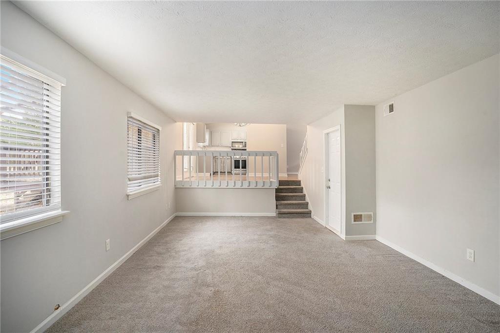 676 Tarkington Road South Stone Mountain, GA 30088 - Photo 10 of 20 a view of a kitchen with refrigerator and windows