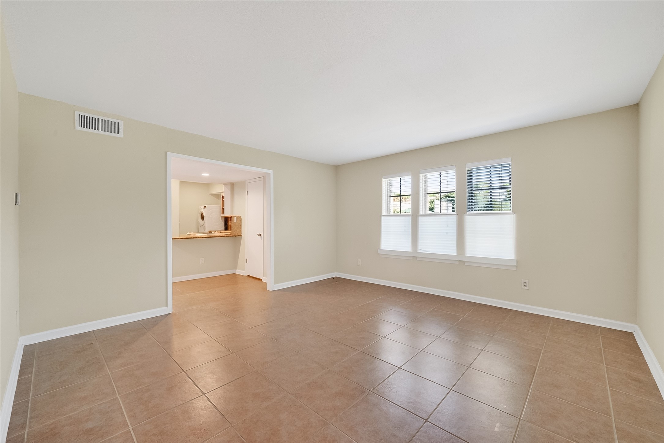 515 Tallowood Road, Unit 9 Houston, TX 77024 - Photo 11 of 18 a view of an empty room with a window