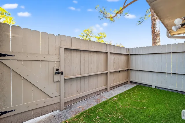 a view of a backyard with potted plants