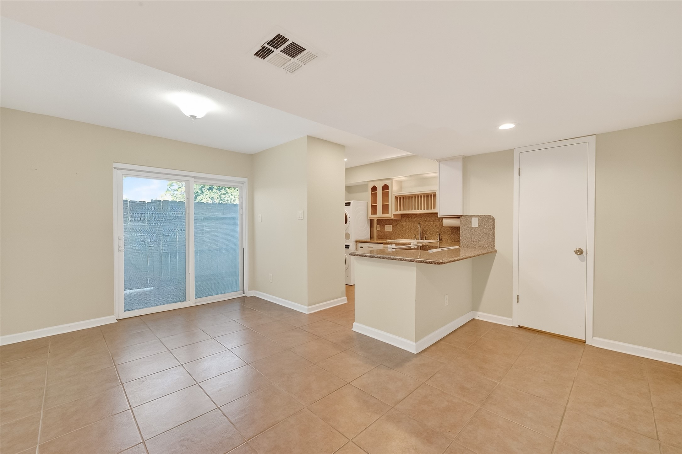 515 Tallowood Road, Unit 9 Houston, TX 77024 - Photo 10 of 18 a view of kitchen with refrigerator and window