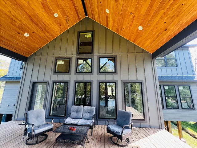 a building outdoor space with patio furniture and potted plants