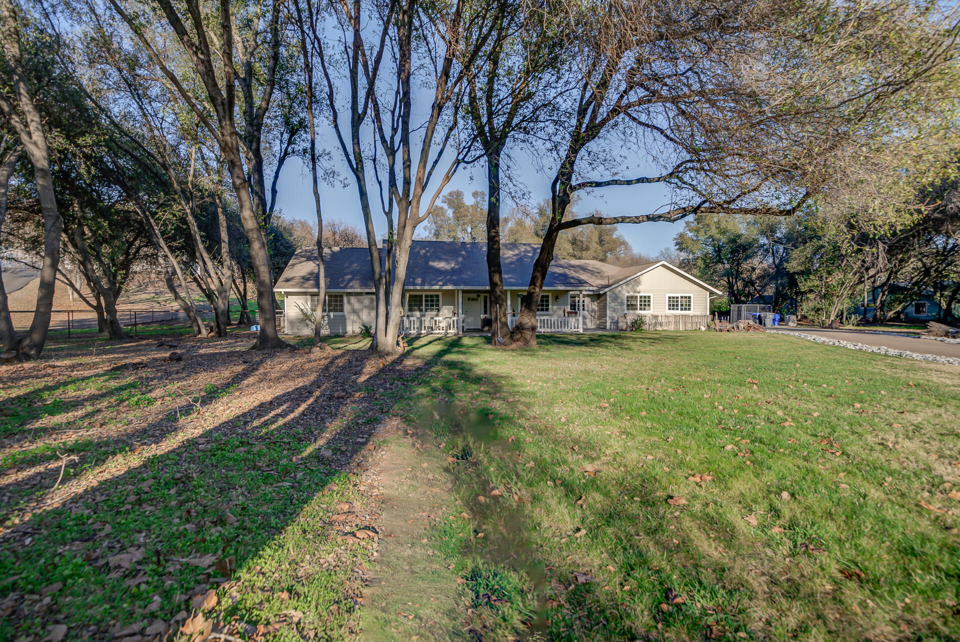14300 Molluc Drive Red Bluff, CA 96080 - Photo 1 of 48 a view of yard with tree and wooden fence