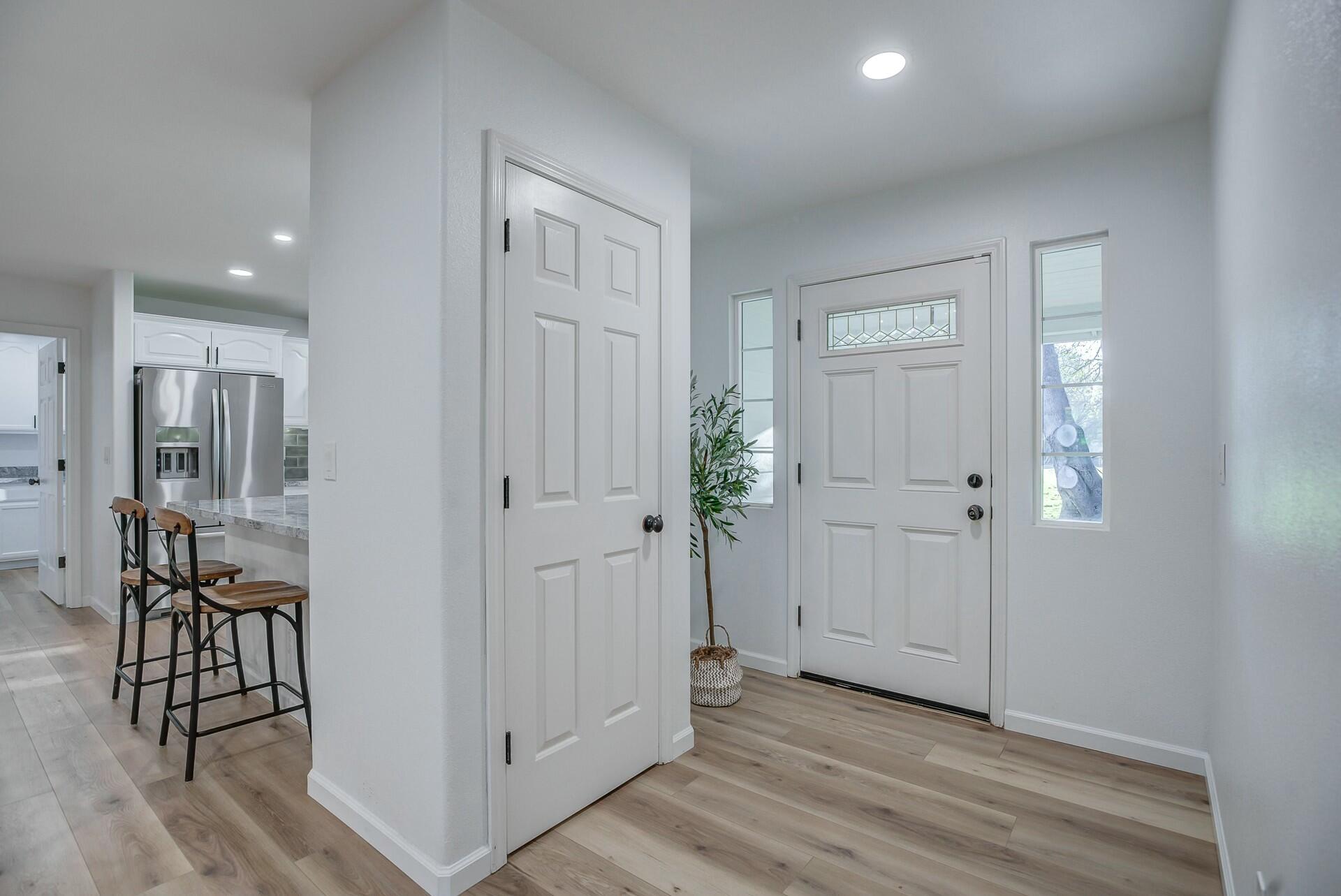 14300 Molluc Drive Red Bluff, CA 96080 - Photo 15 of 48 an empty room with wooden floor and windows