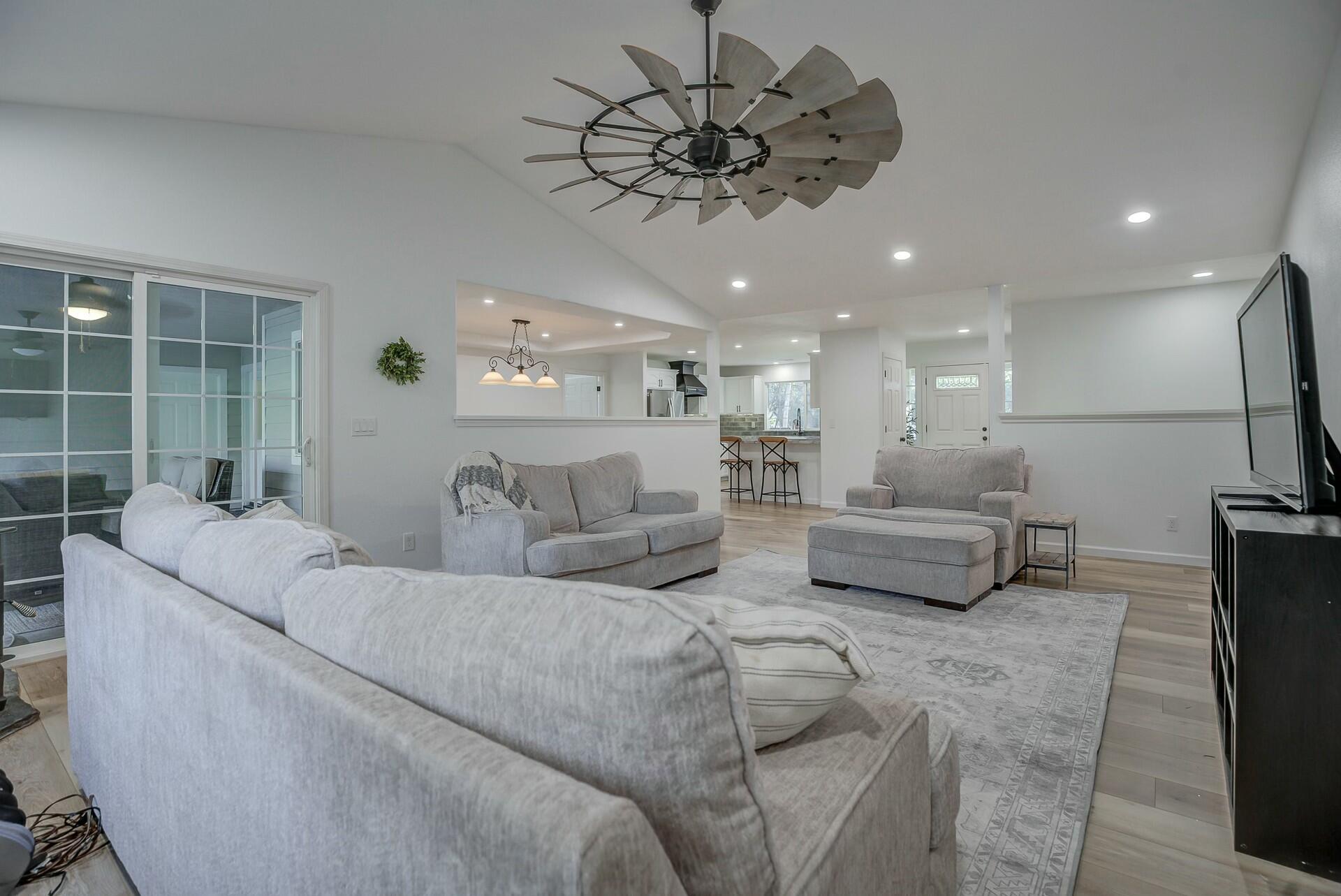14300 Molluc Drive Red Bluff, CA 96080 - Photo 18 of 48 a living room with furniture and a chandelier
