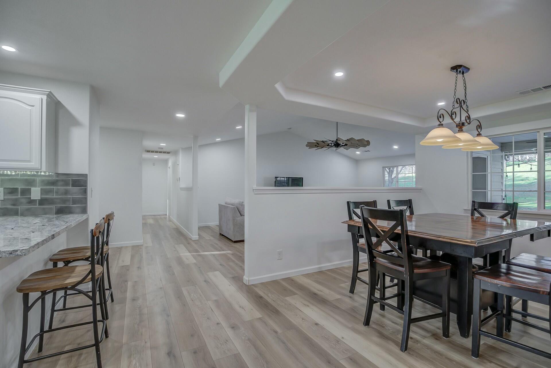 14300 Molluc Drive Red Bluff, CA 96080 - Photo 25 of 48 a view of a dining room with furniture and wooden floor
