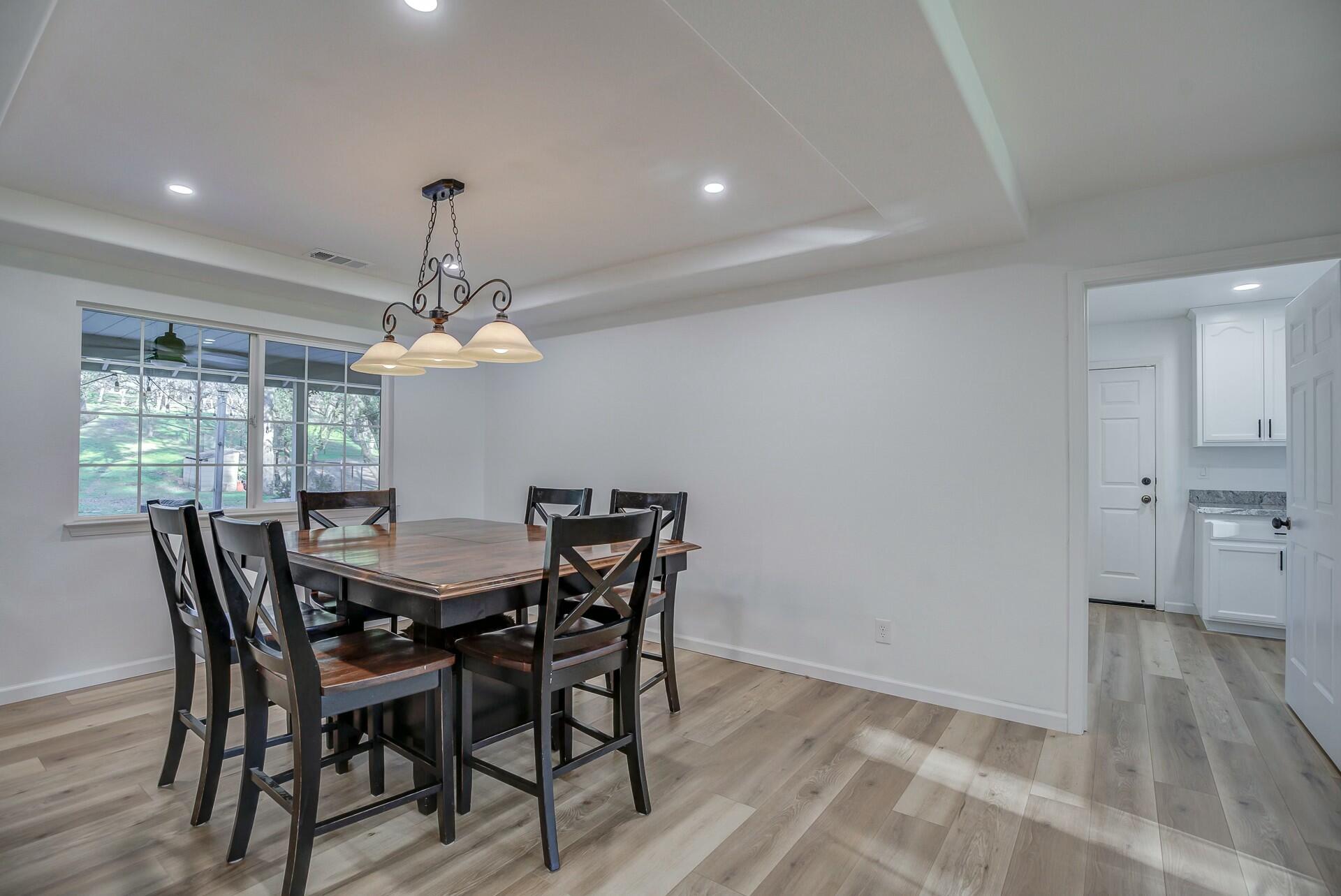 14300 Molluc Drive Red Bluff, CA 96080 - Photo 26 of 48 a view of a dining room with furniture window and wooden floor