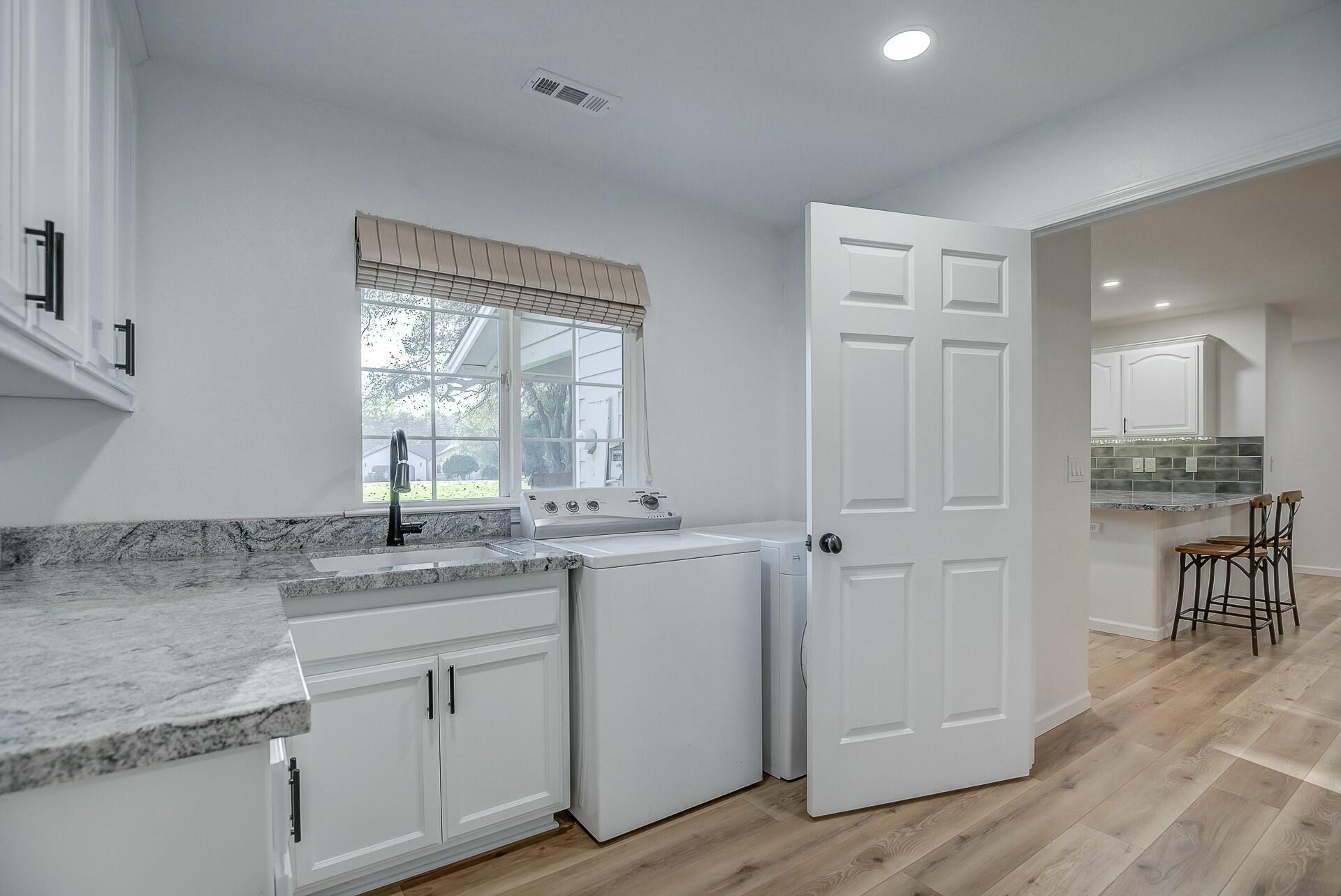 14300 Molluc Drive Red Bluff, CA 96080 - Photo 29 of 48 a bathroom with a granite countertop sink and a mirror