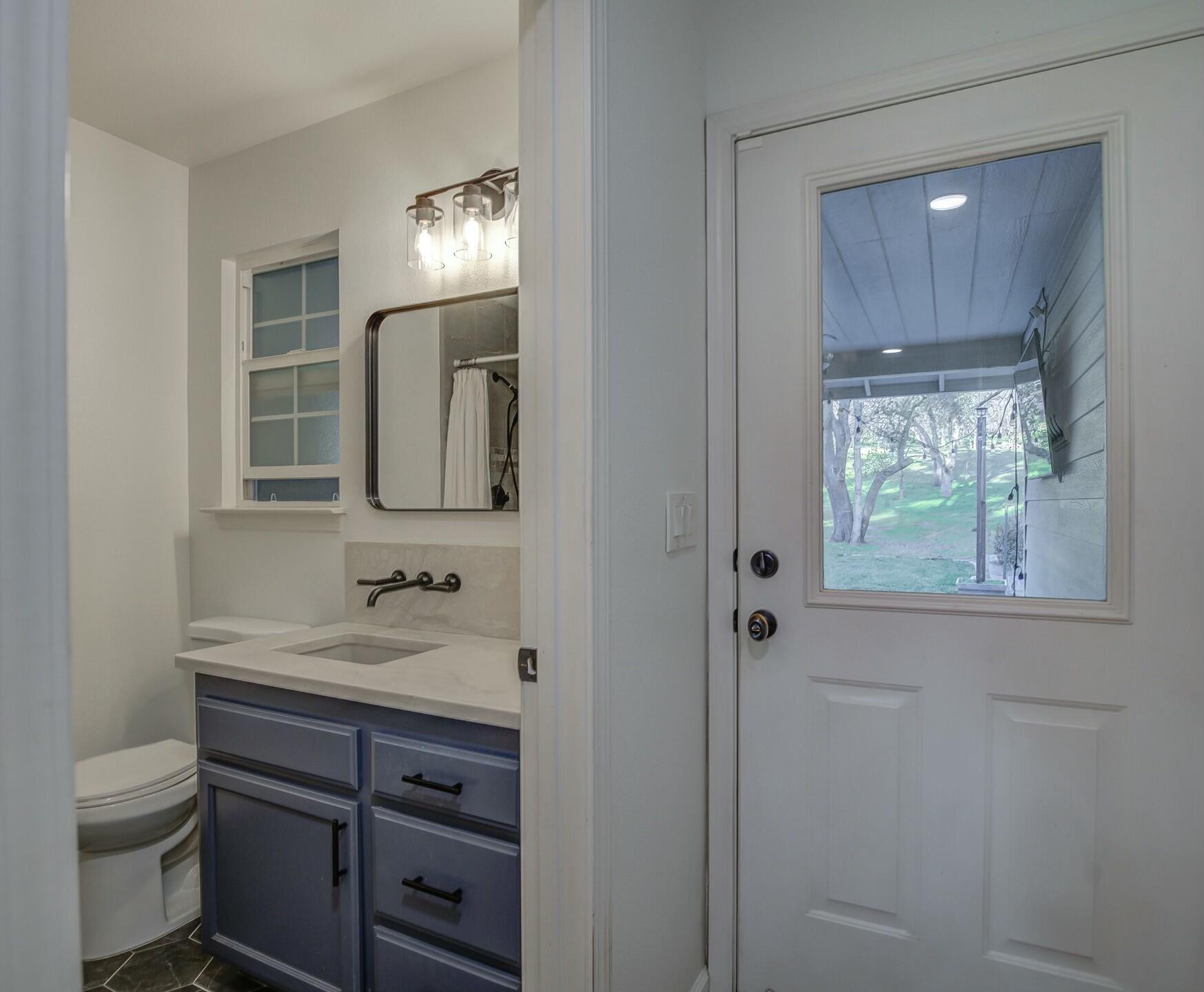 14300 Molluc Drive Red Bluff, CA 96080 - Photo 32 of 48 a bathroom with a sink and a mirror
