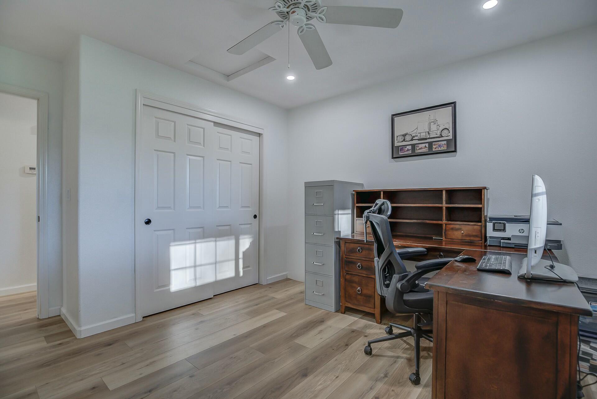 14300 Molluc Drive Red Bluff, CA 96080 - Photo 34 of 48 a view of a workspace with furniture and wooden floor