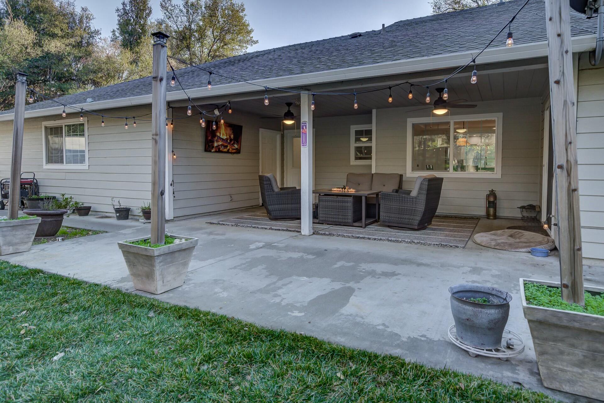 14300 Molluc Drive Red Bluff, CA 96080 - Photo 47 of 48 a view of a patio with table and chairs potted plants