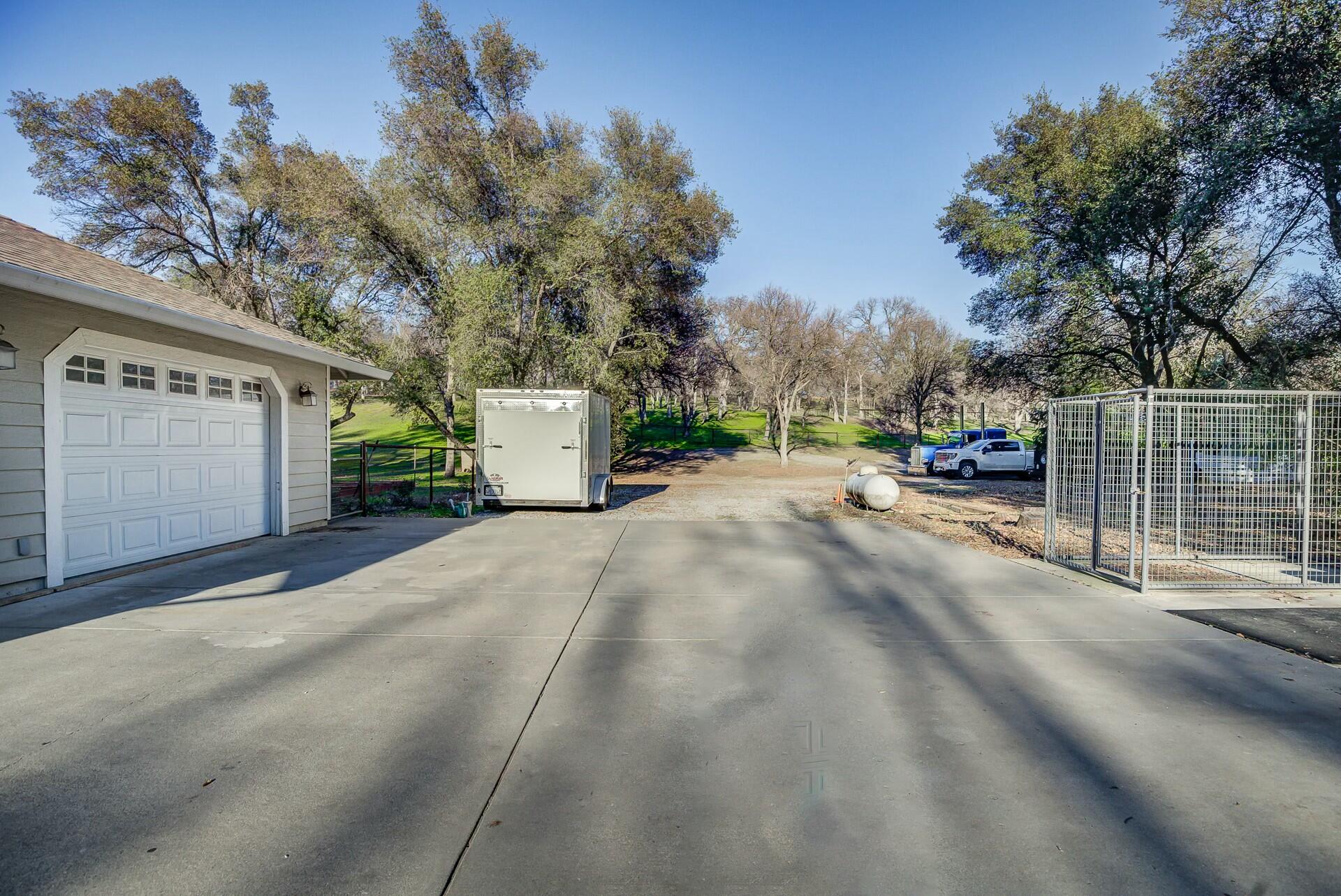 14300 Molluc Drive Red Bluff, CA 96080 - Photo 6 of 48 a view of a street with a house in the background