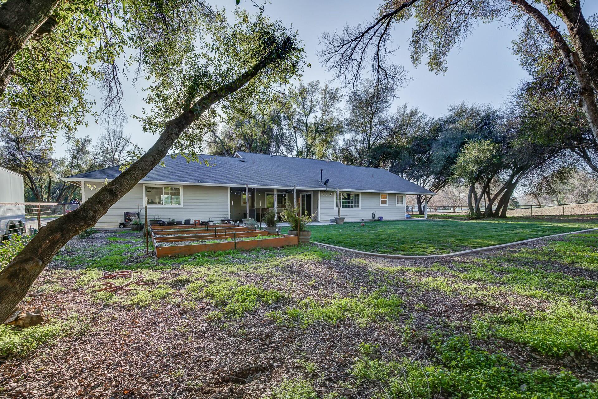 14300 Molluc Drive Red Bluff, CA 96080 - Photo 7 of 48 a view of a house with yard and sitting area