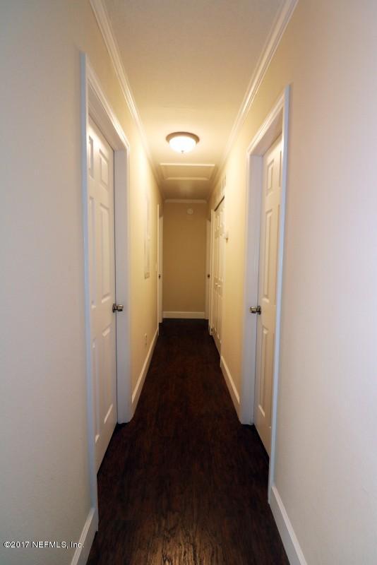8584 Old Plank Road Jacksonville, FL 32220 - Photo 12 of 23 a view of a hallway with a hardwood floor