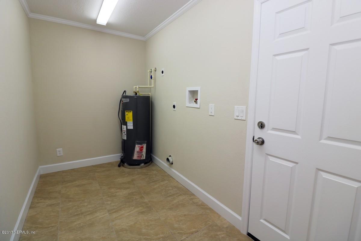 8584 Old Plank Road Jacksonville, FL 32220 - Photo 5 of 23 a view of a room with wooden floor