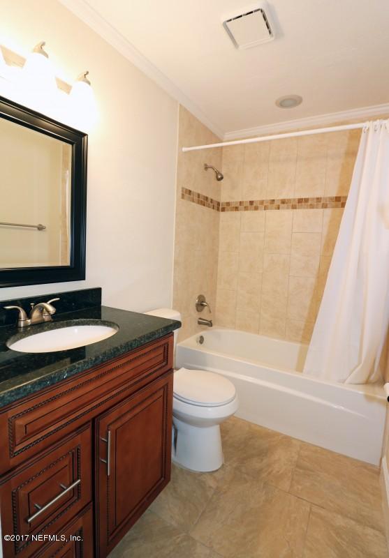 8584 Old Plank Road Jacksonville, FL 32220 - Photo 7 of 23 a bathroom with a granite countertop sink toilet and shower