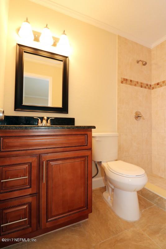 8584 Old Plank Road Jacksonville, FL 32220 - Photo 10 of 23 a bathroom with a toilet sink and mirror