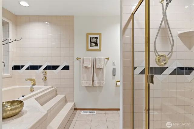 a bathroom with a tub and sink