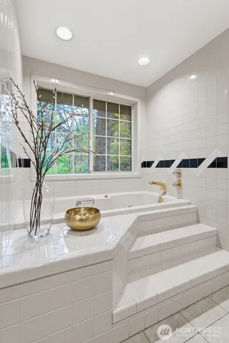 a bedroom with a bed and a lamp