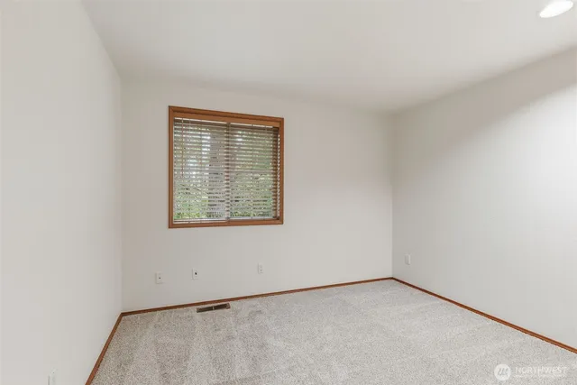 a bathroom with a double vanity sink and mirror