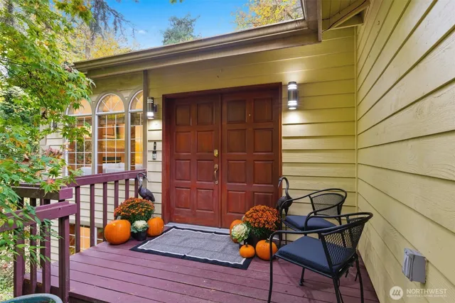 a backyard of a house with table and chairs