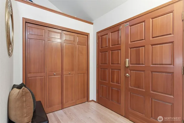 a living room with furniture a fireplace and a large window
