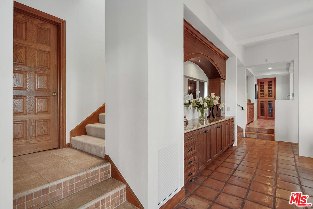 16814 Oak View Drive Encino, CA 91436 - Photo 14 of 49 a hallway with cabinets