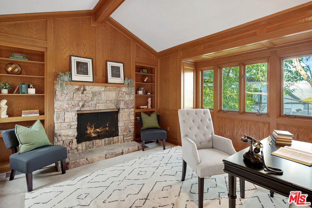 16814 Oak View Drive Encino, CA 91436 - Photo 16 of 49 a living room with furniture and a fireplace