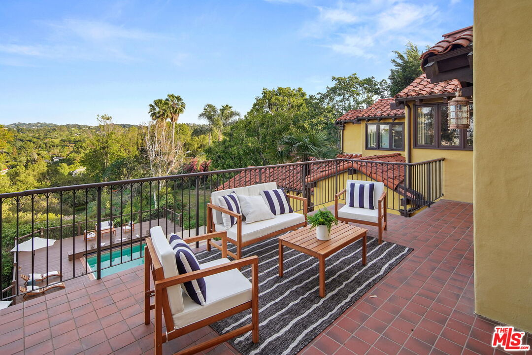 16814 Oak View Drive Encino, CA 91436 - Photo 25 of 49 a view of a chairs and table on the roof deck