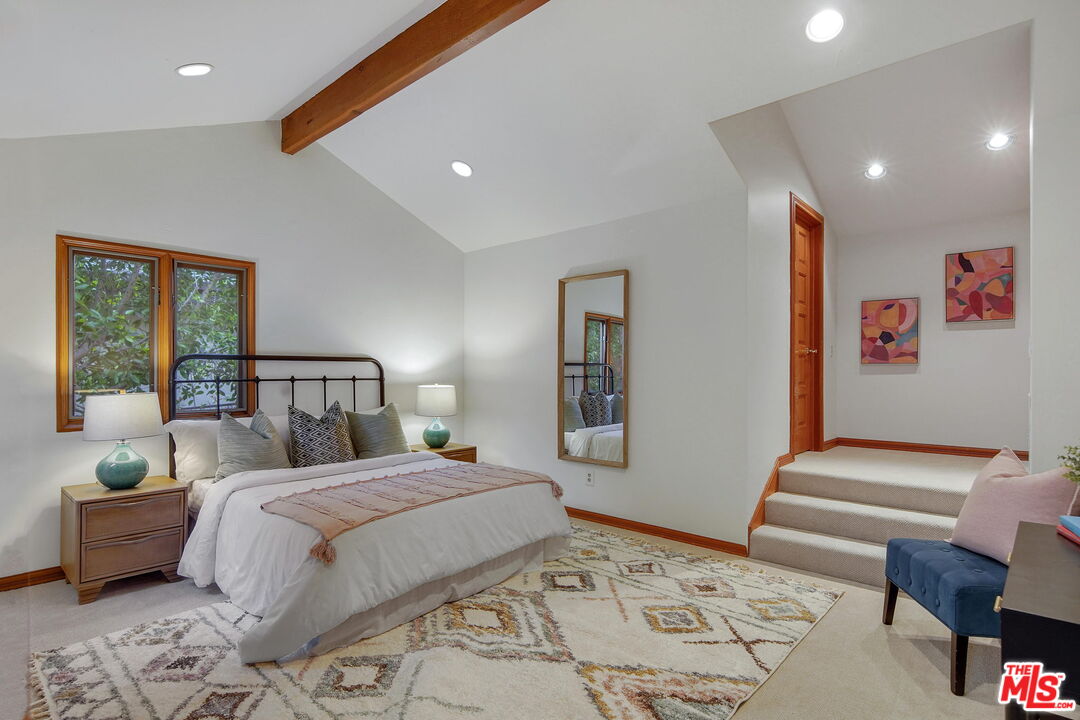 16814 Oak View Drive Encino, CA 91436 - Photo 30 of 49 a bedroom with a bed and wooden floor