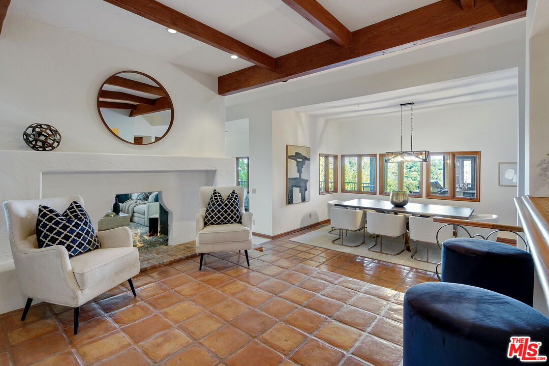 16814 Oak View Drive Encino, CA 91436 - Photo 4 of 49 a living room with furniture and a floor to ceiling window