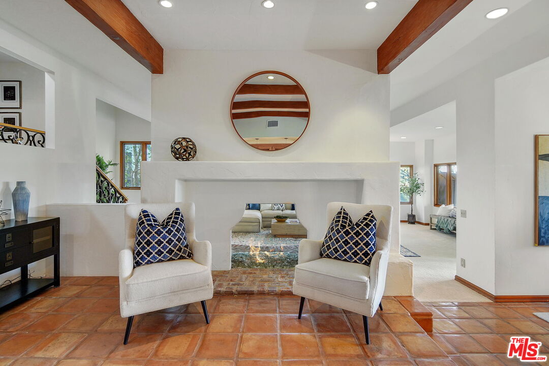 16814 Oak View Drive Encino, CA 91436 - Photo 5 of 49 a living room with furniture and a large mirror
