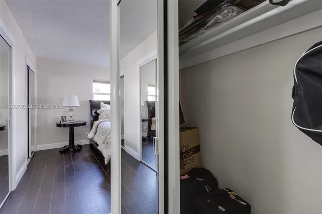 a view of a bedroom and utility room