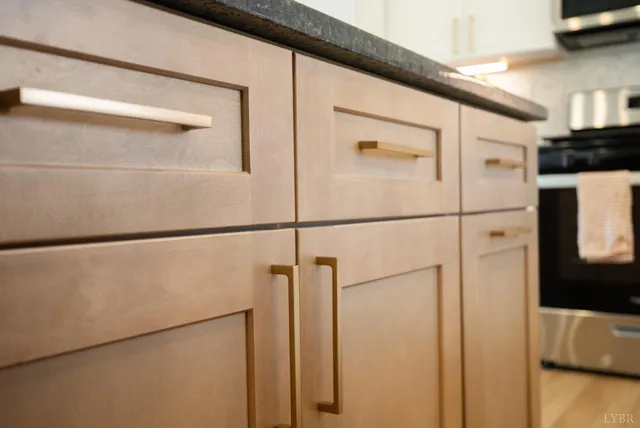 a bathroom with a granite countertop sink a toilet and a mirror