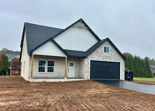 a bedroom with furniture and a fireplace