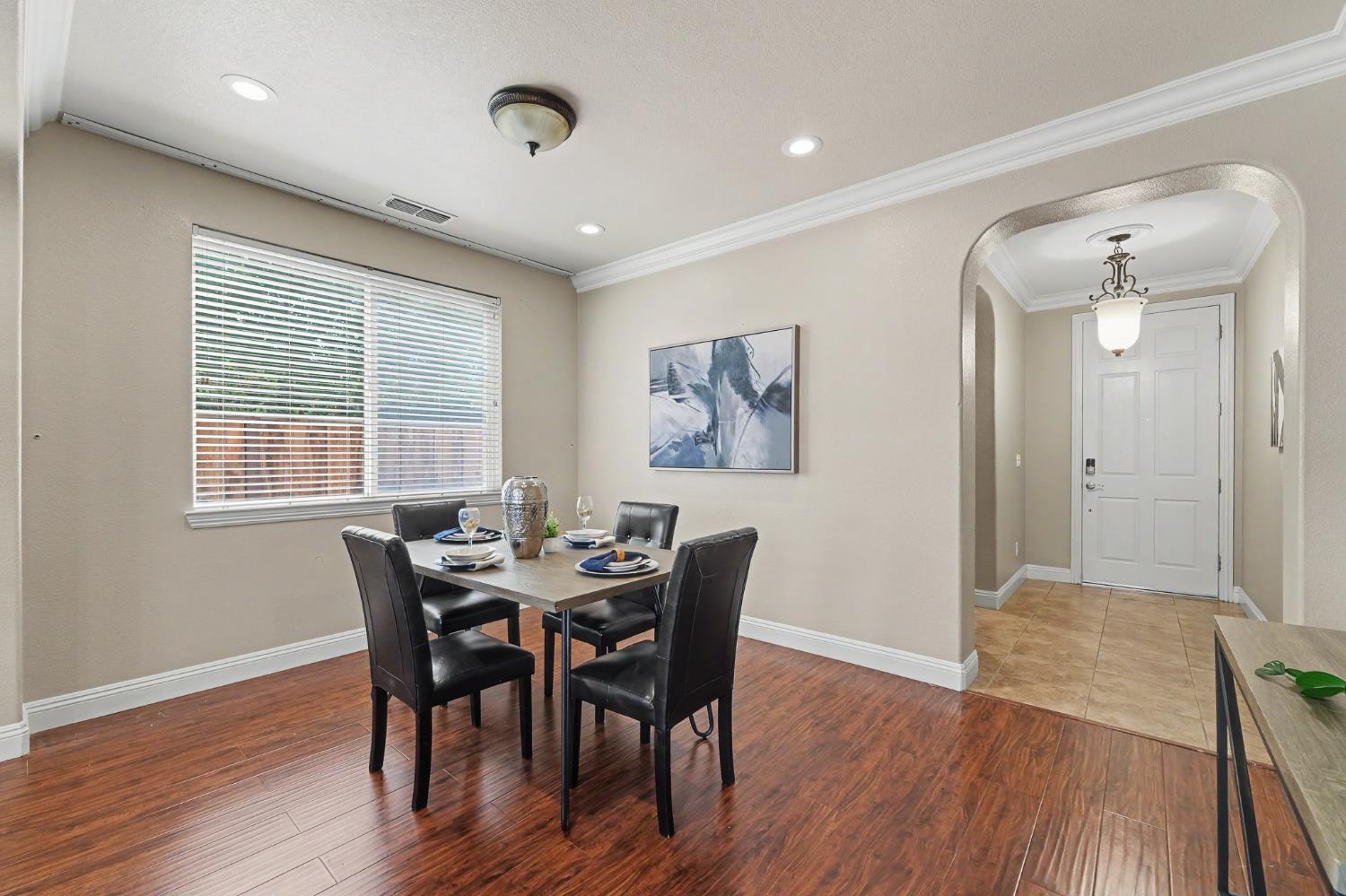 1223 East Springer Drive Turlock, CA 95382 - Photo 8 of 48 a view of a dining room with furniture and wooden floor
