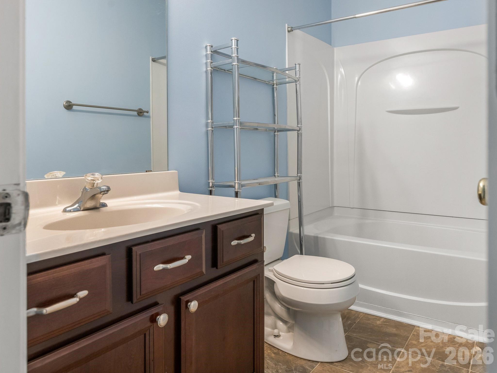 3259 Blythe Ridge Court Charlotte, NC 28213 - Photo 11 of 17 a bathroom with a sink toilet vanity and shower