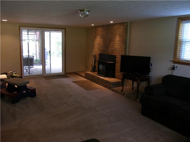 887 Vanderbilt Road Mount Juliet, TN 37122 - Photo 10 of 19 Den in basement. Woodburning fireplace