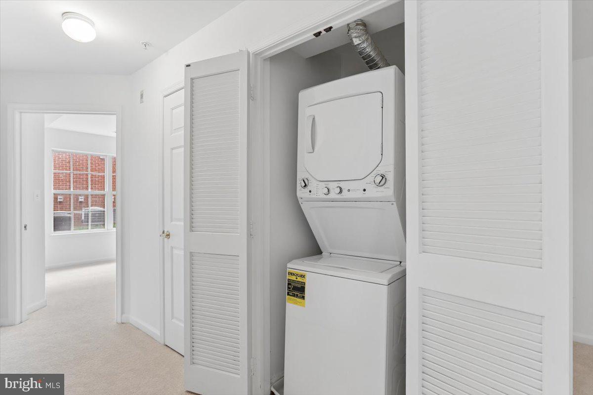 631 Constellation Square Southeast, Unit D Leesburg, VA 20175 - Photo 18 of 22 a utility room with dryer and washer