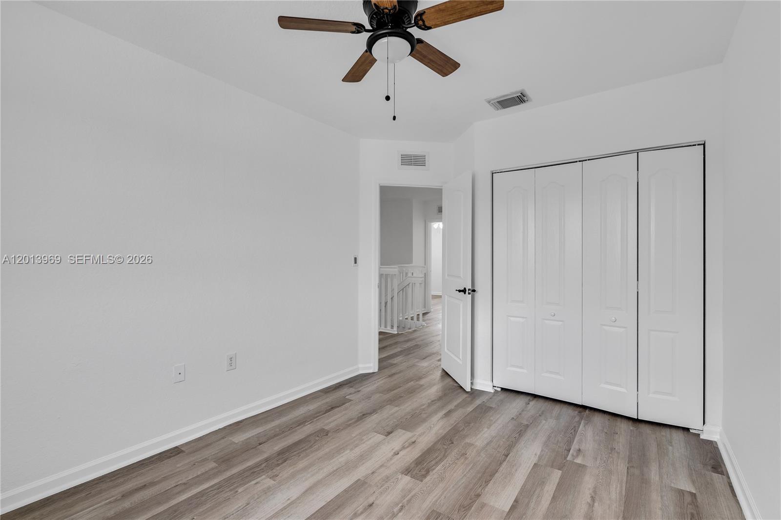 14044 Southwest 273rd Lane, Unit 14044 Homestead, FL 33032 - Photo 25 of 44 a view of an empty room and window