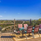 a view of a chairs and table on the terrace