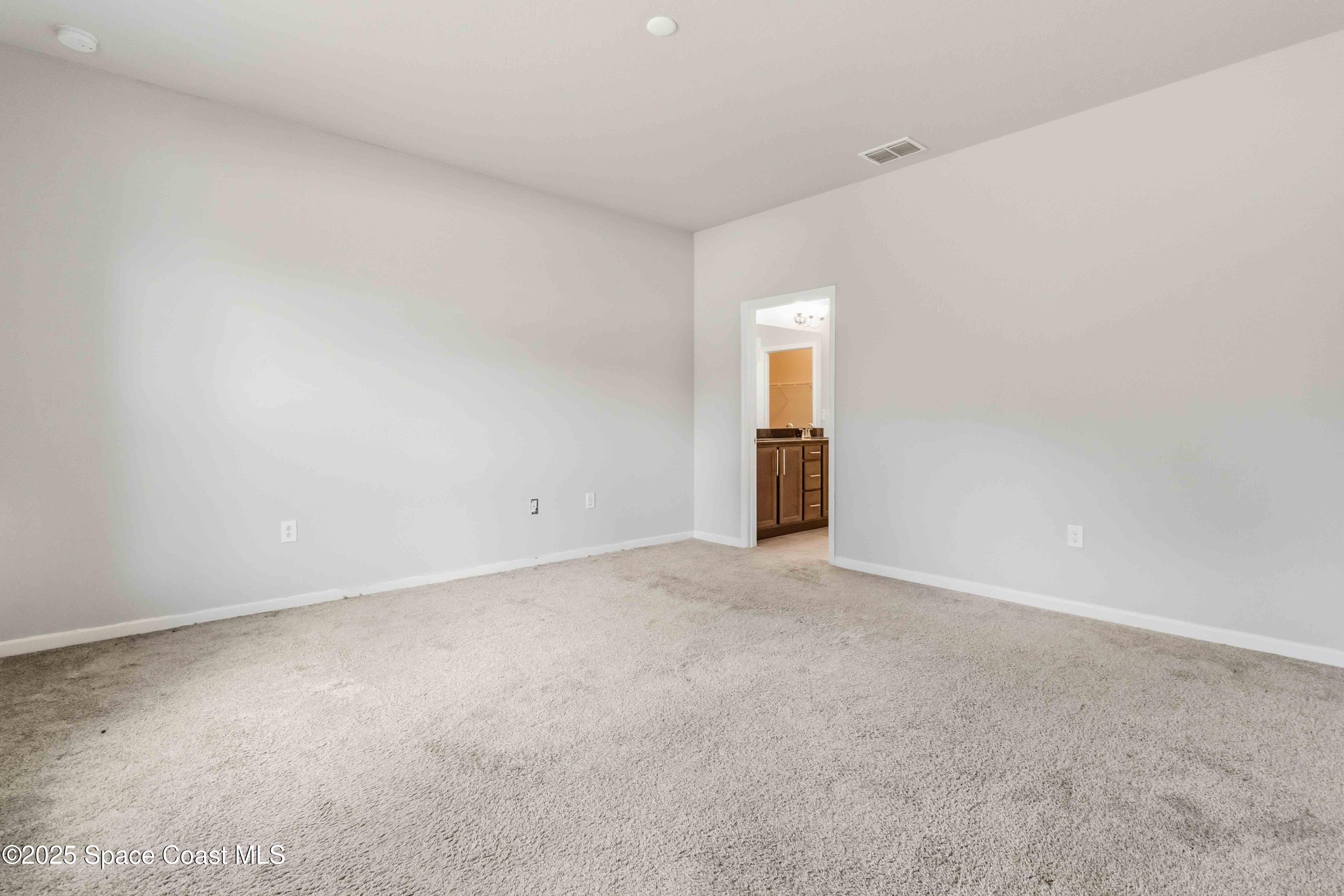 988 Corbin Circle Southwest Palm Bay, FL 32908 - Photo 10 of 26 a view of an empty room and a window