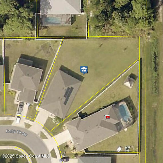 988 Corbin Circle Southwest Palm Bay, FL 32908 - Photo 24 of 26 an aerial view of a house with a yard