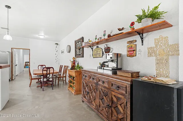 a very nice looking dining room with a table and chairs