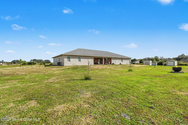 a house view with a swimming pool