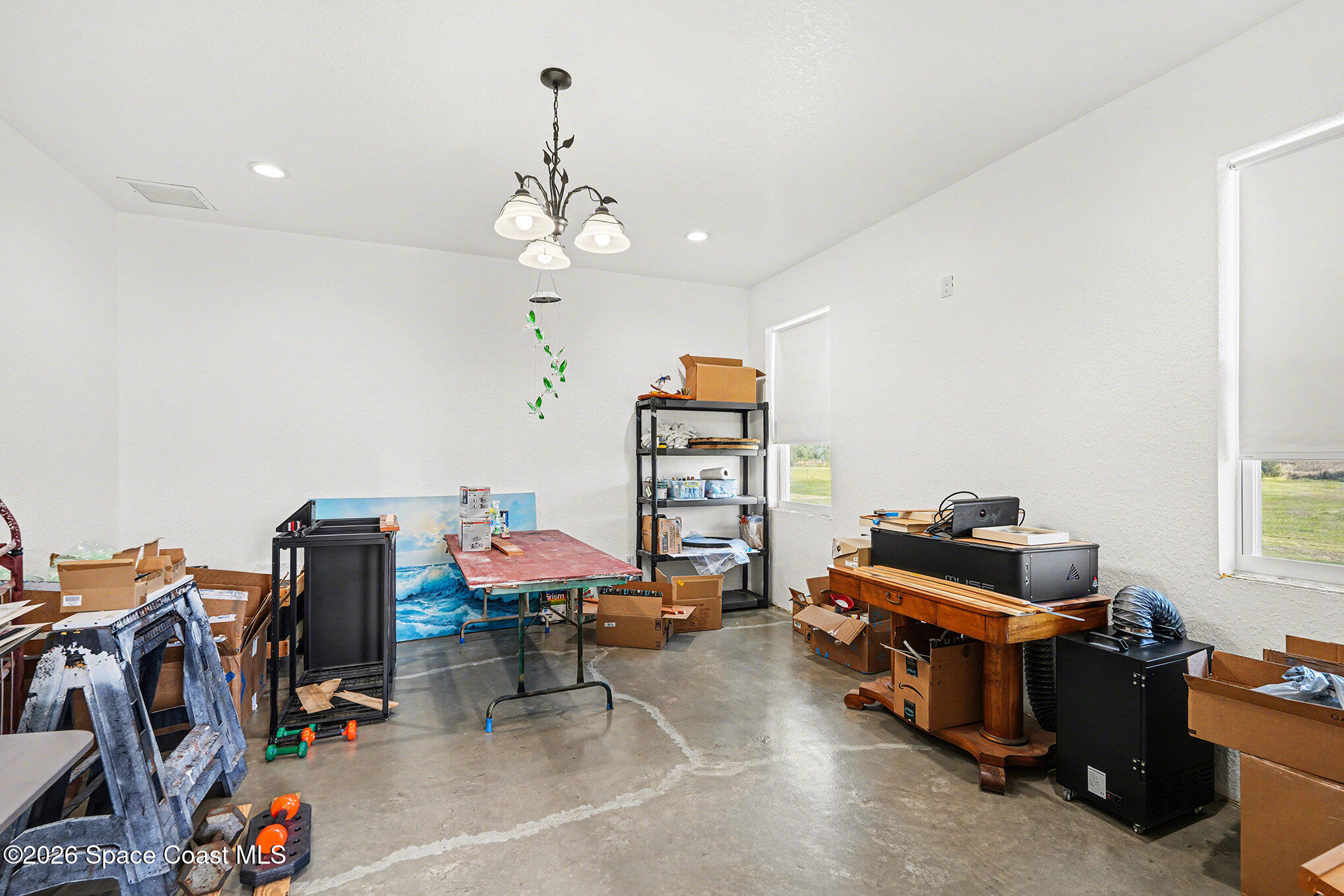 4960 Dixie Way Mims, FL 32754 - Photo 22 of 29 a bedroom with furniture and a gym equipment