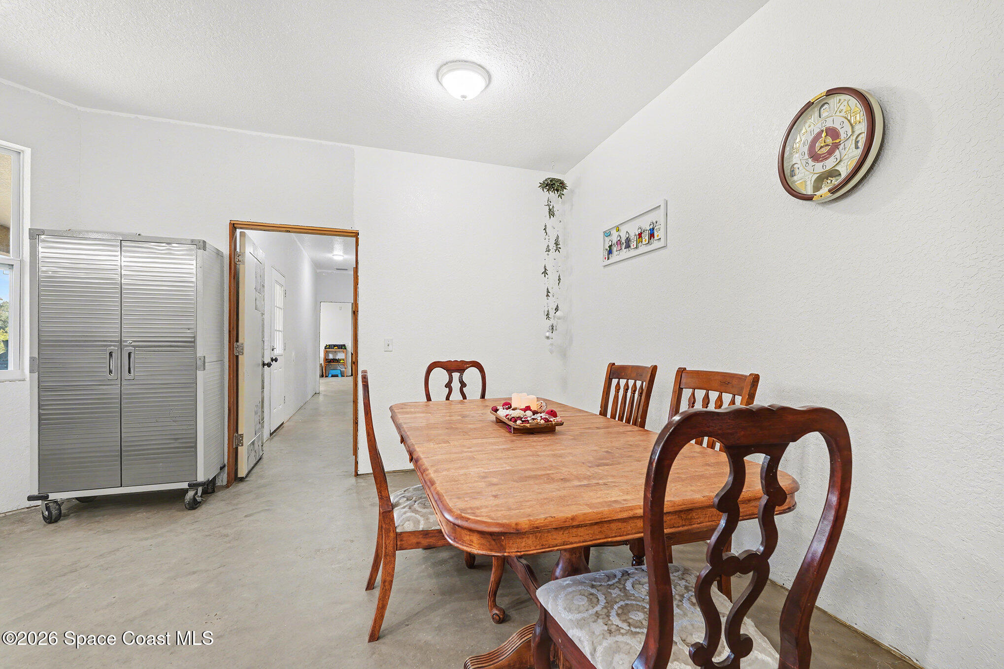 4960 Dixie Way Mims, FL 32754 - Photo 24 of 29 a view of a dining room with furniture